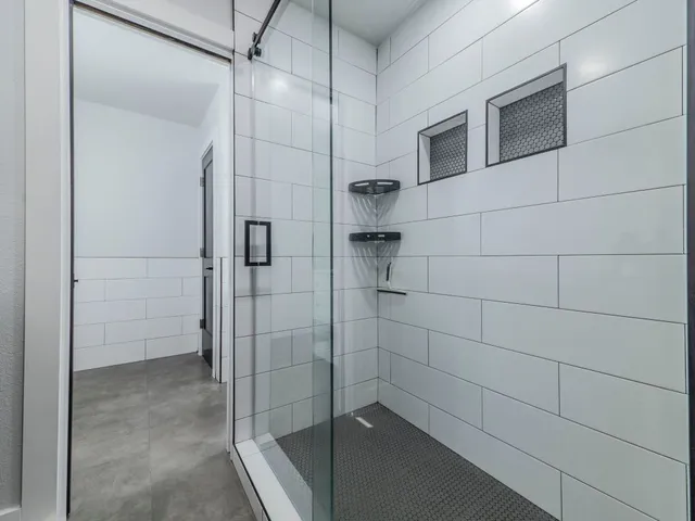 a view of a workspace with furniture and a chandelier fan