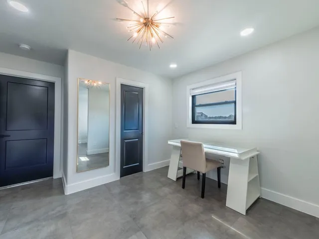 a bathroom with a toilet a sink and a mirror