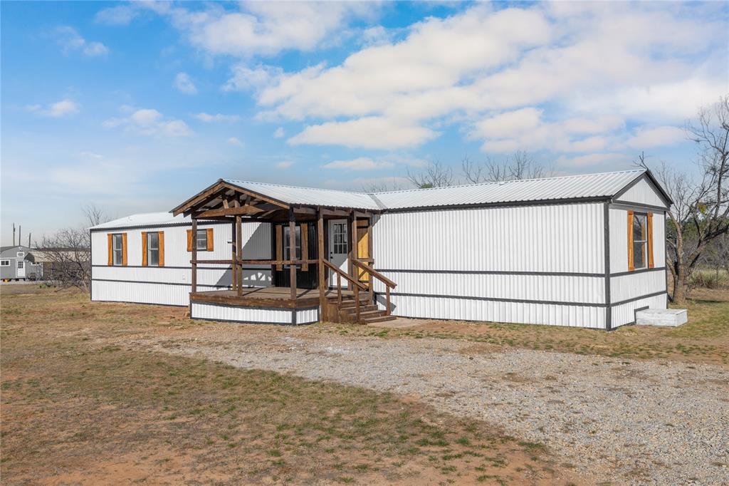 3393 Doe Trail Road Brownwood, TX 76801 - Photo 18 of 29 a white house with tree in the background