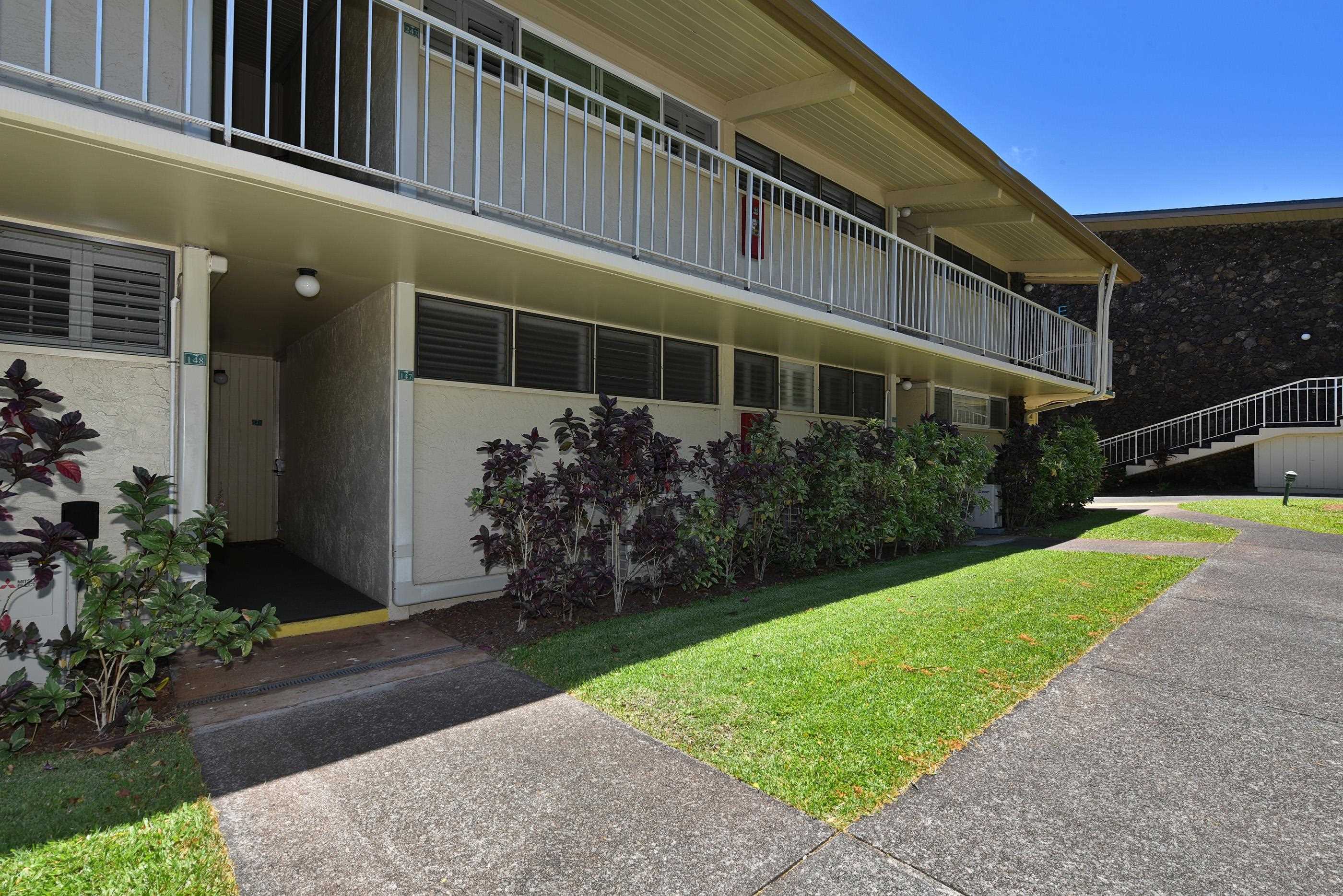 5315 Lower Honoapiilani Road, Unit F147 Lahaina, HI 96761 - Photo 27 of 41 a front view of a house with a yard