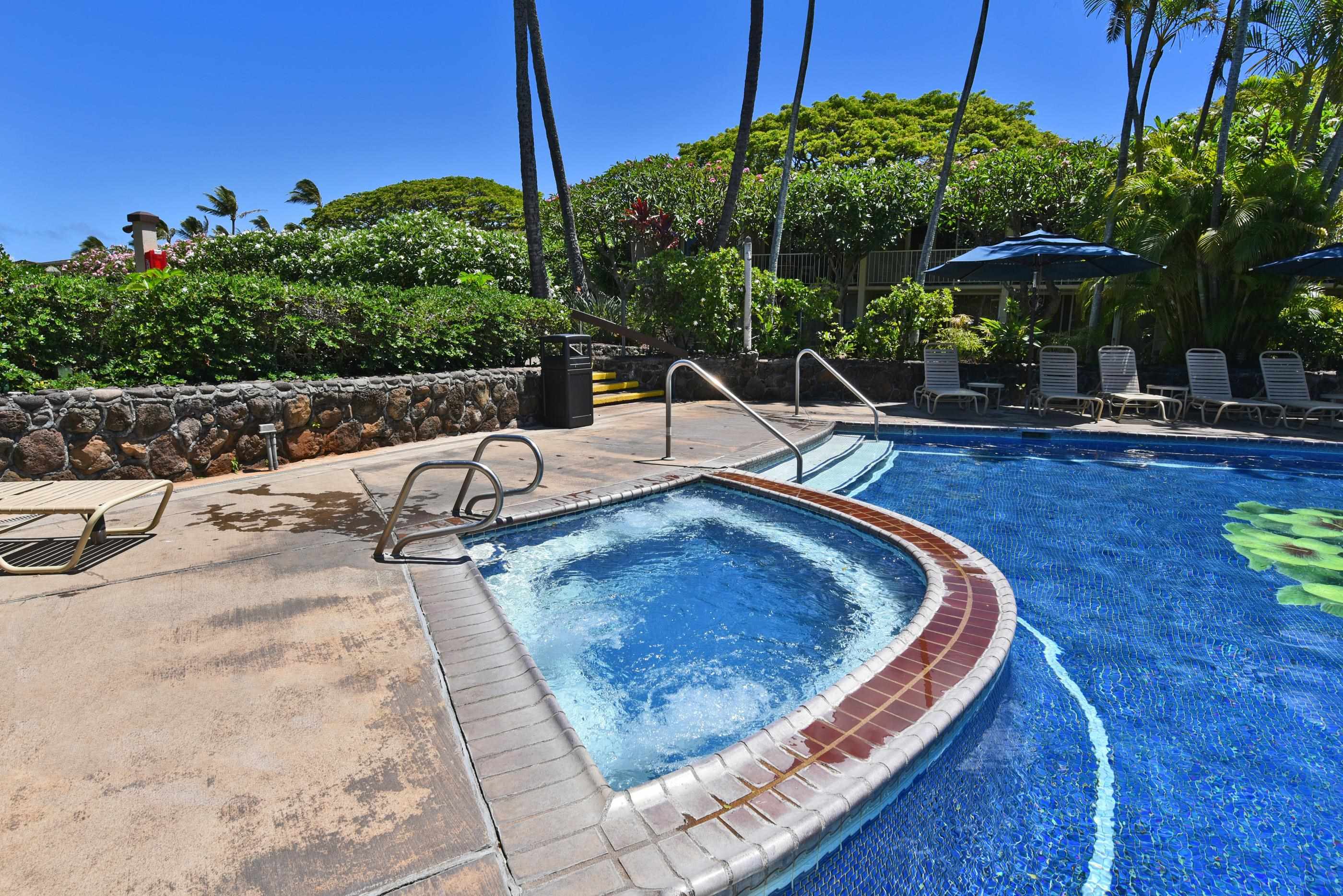 5315 Lower Honoapiilani Road, Unit F147 Lahaina, HI 96761 - Photo 33 of 41 a view of a swimming pool with a patio and a yard