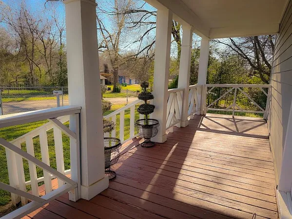 a view of balcony with wooden floor