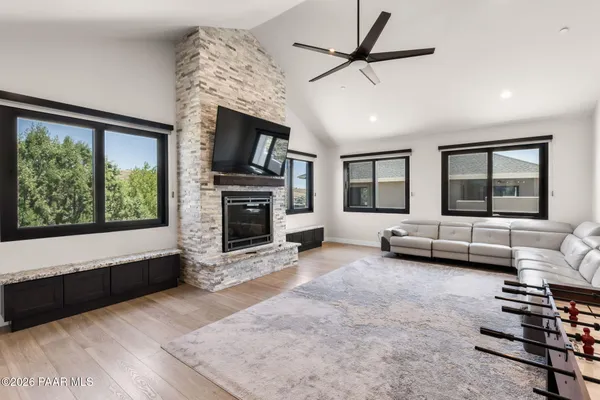 a living room with furniture and a fireplace