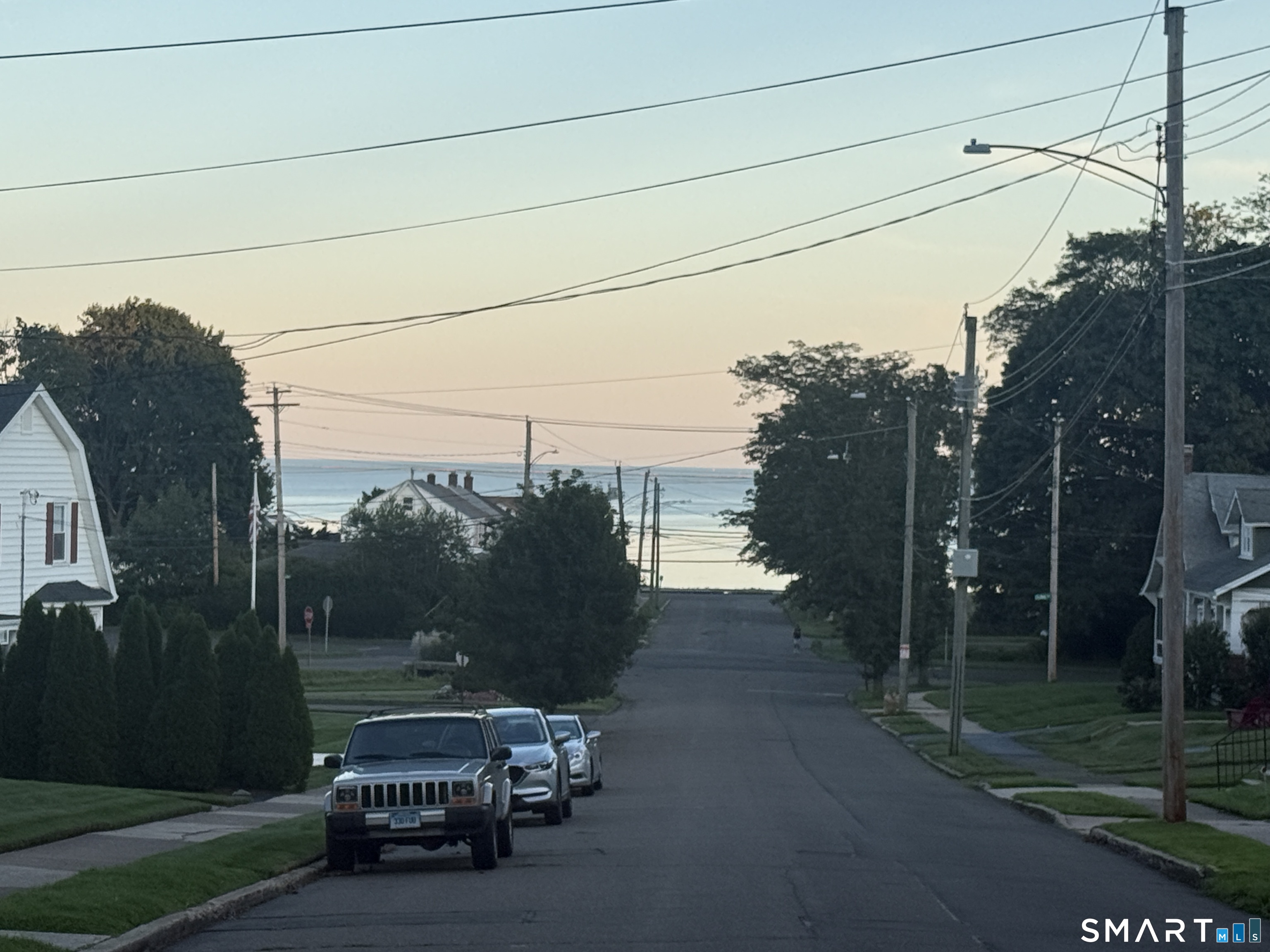 17 Honor Road West Haven, CT 06516 - Photo 36 of 40 Sunset photo of Long Island Sound from the intersection of Honor Rd and Lake St.