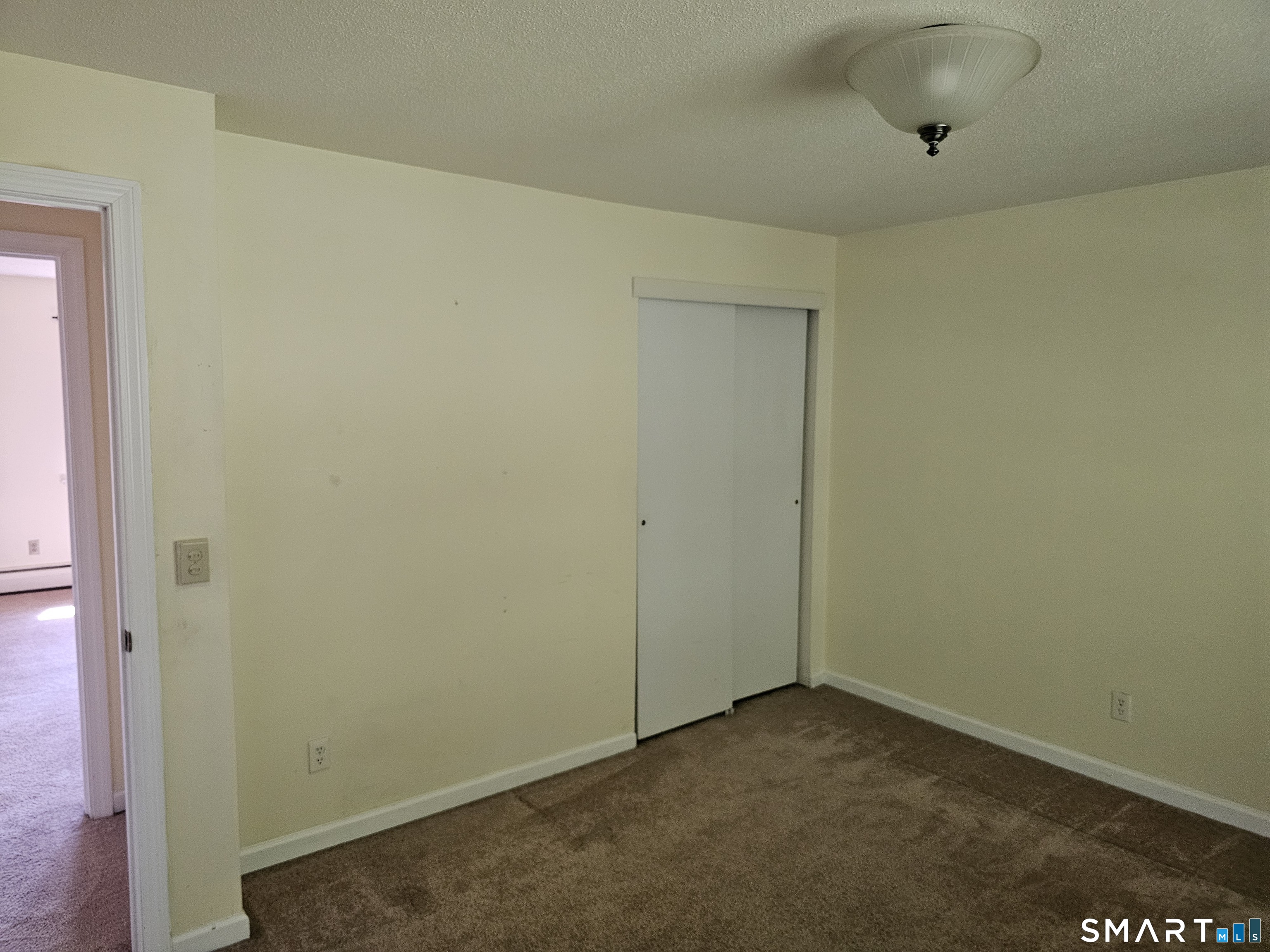 Undisclosed Address Cheshire, CT 06410 - Photo 11 of 12 an empty room with a space
