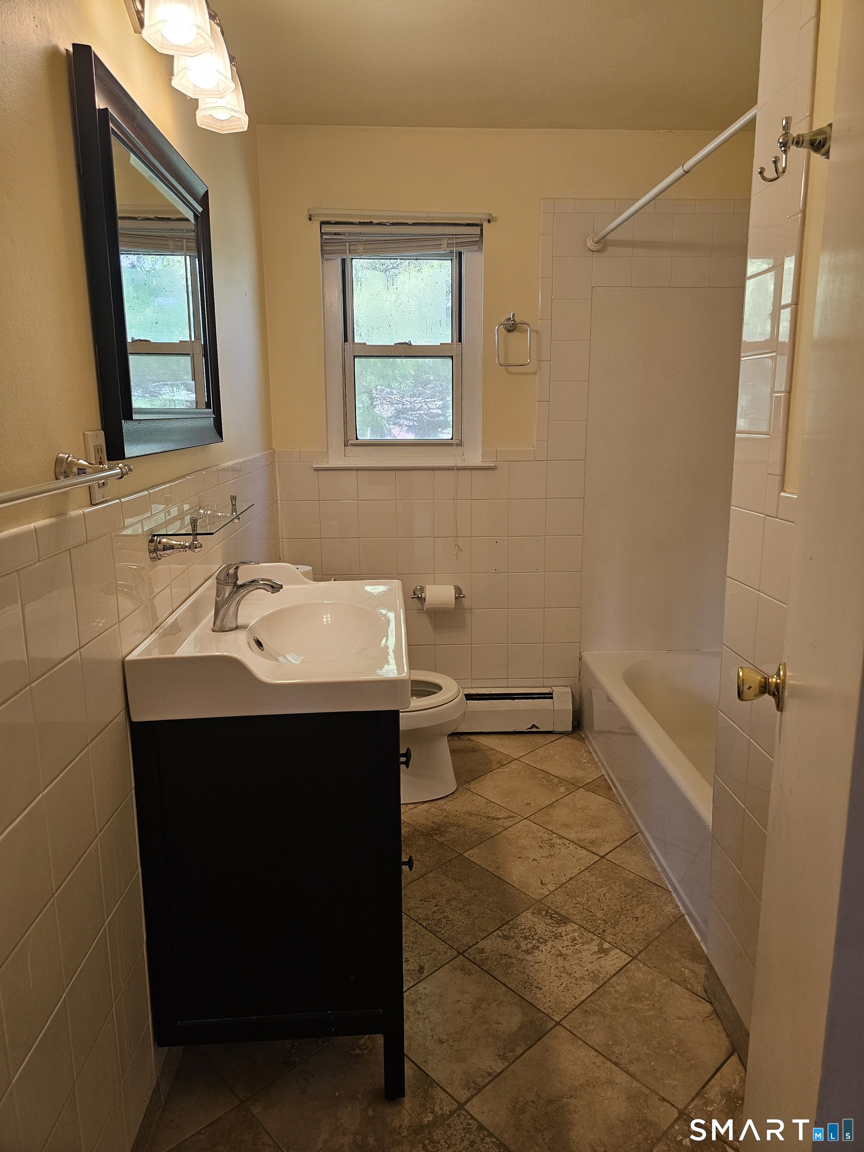 Undisclosed Address Cheshire, CT 06410 - Photo 12 of 12 a bathroom with a sink a toilet and shower