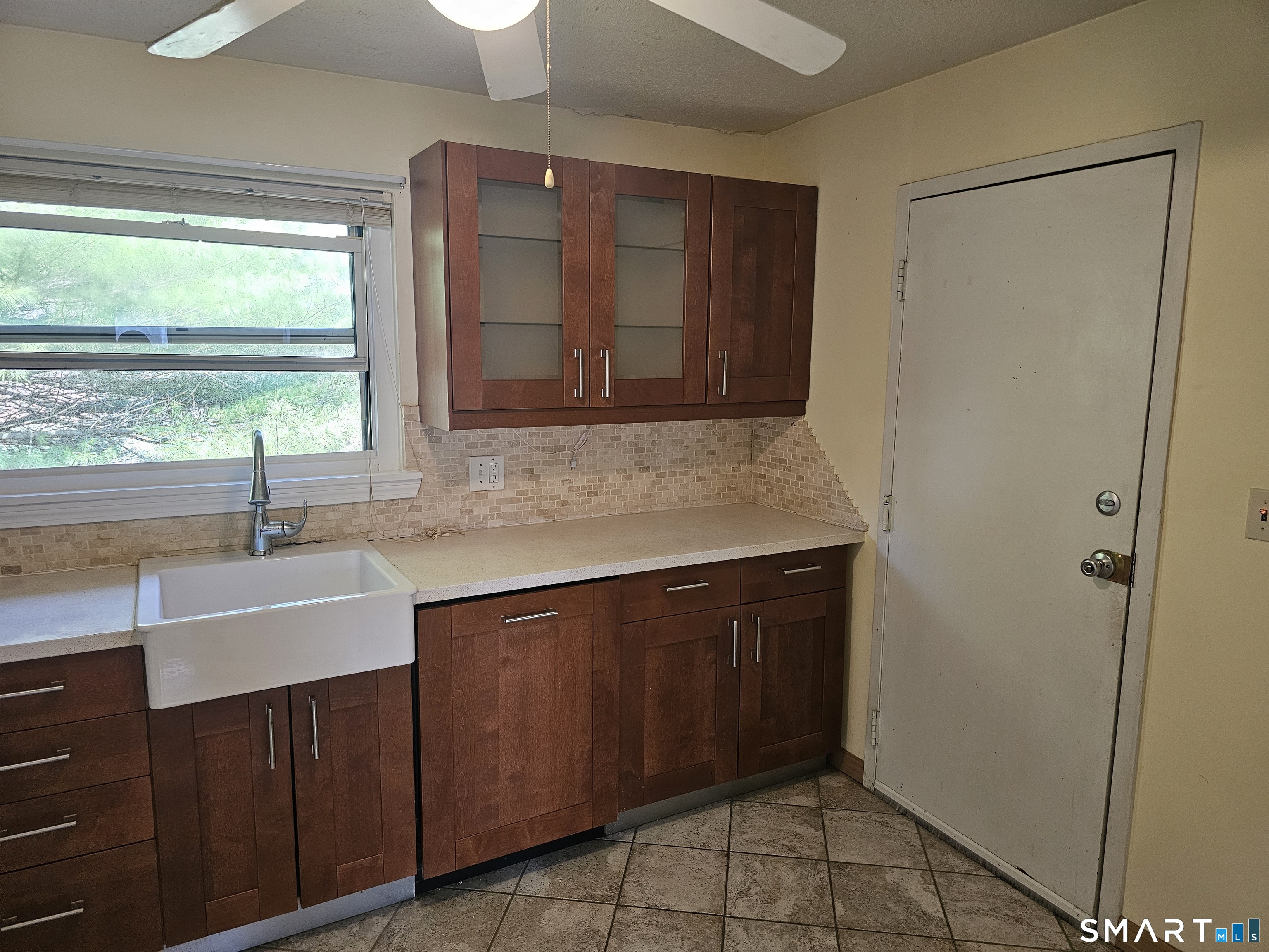 Undisclosed Address Cheshire, CT 06410 - Photo 5 of 12 a kitchen with a sink and a refrigerator