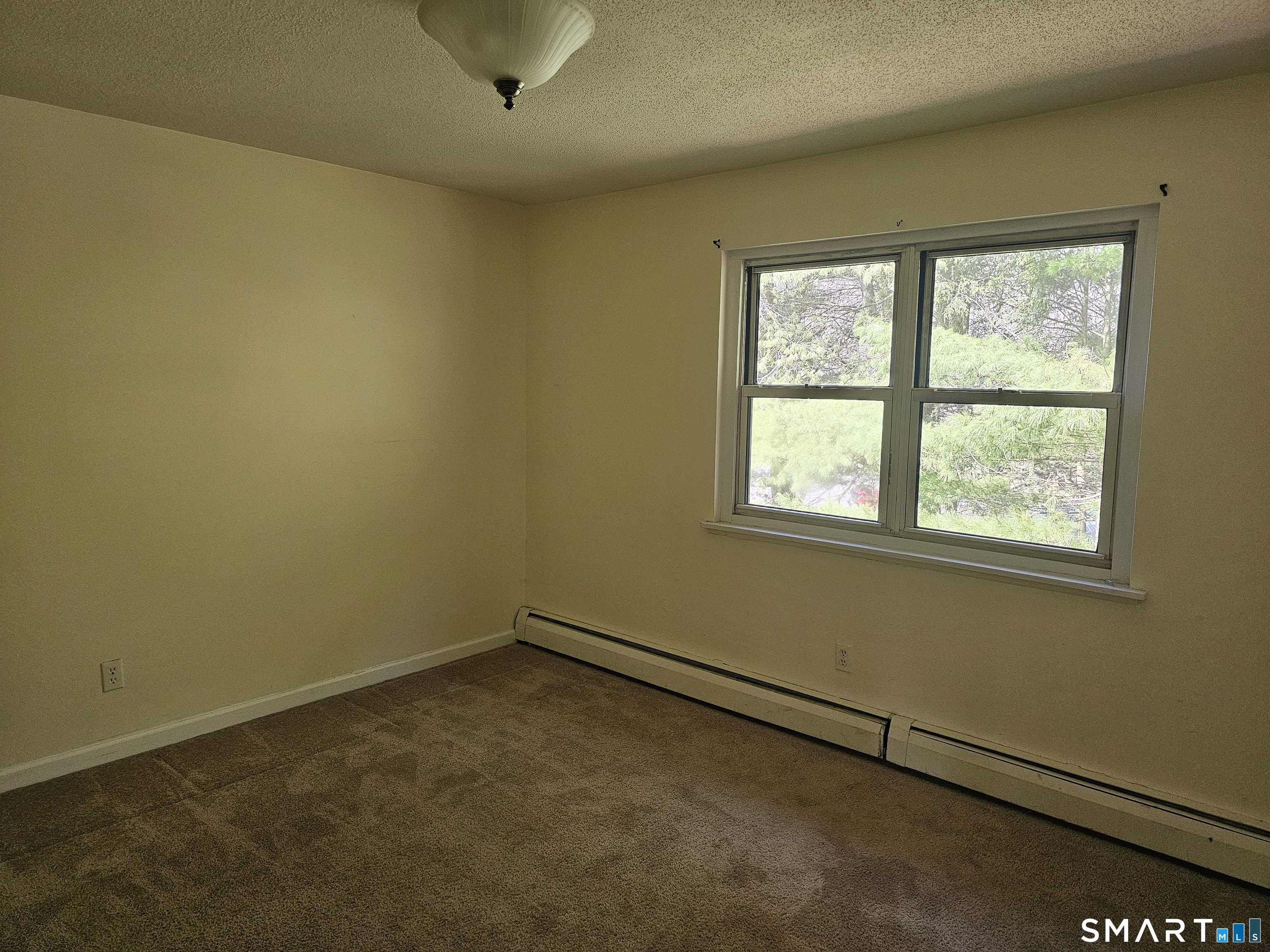 Undisclosed Address Cheshire, CT 06410 - Photo 10 of 12 an empty room with a window