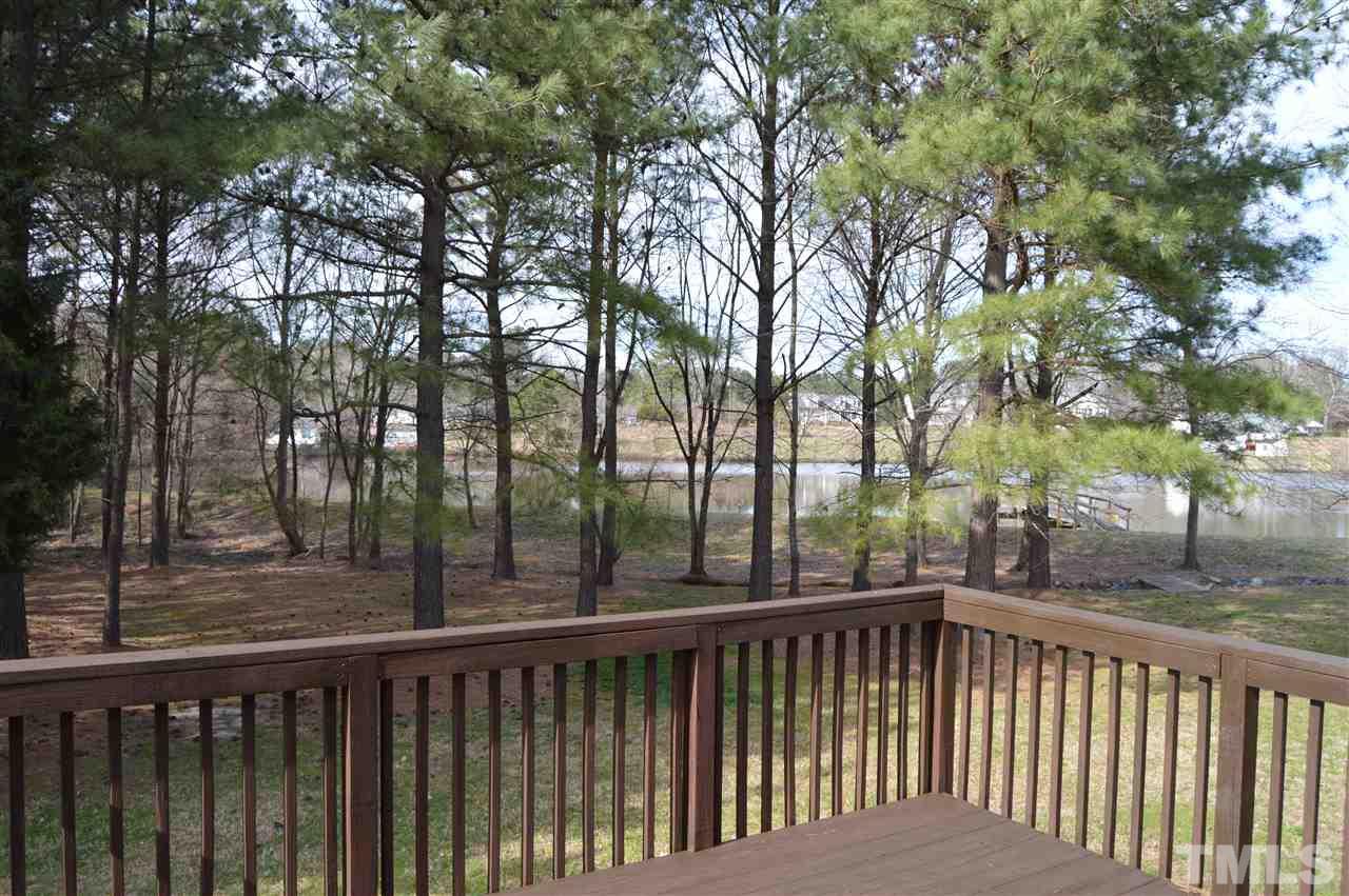 1069 Wheeler Pond Road Creedmoor, NC 27522 - Photo 18 of 22 a balcony with trees in front of it