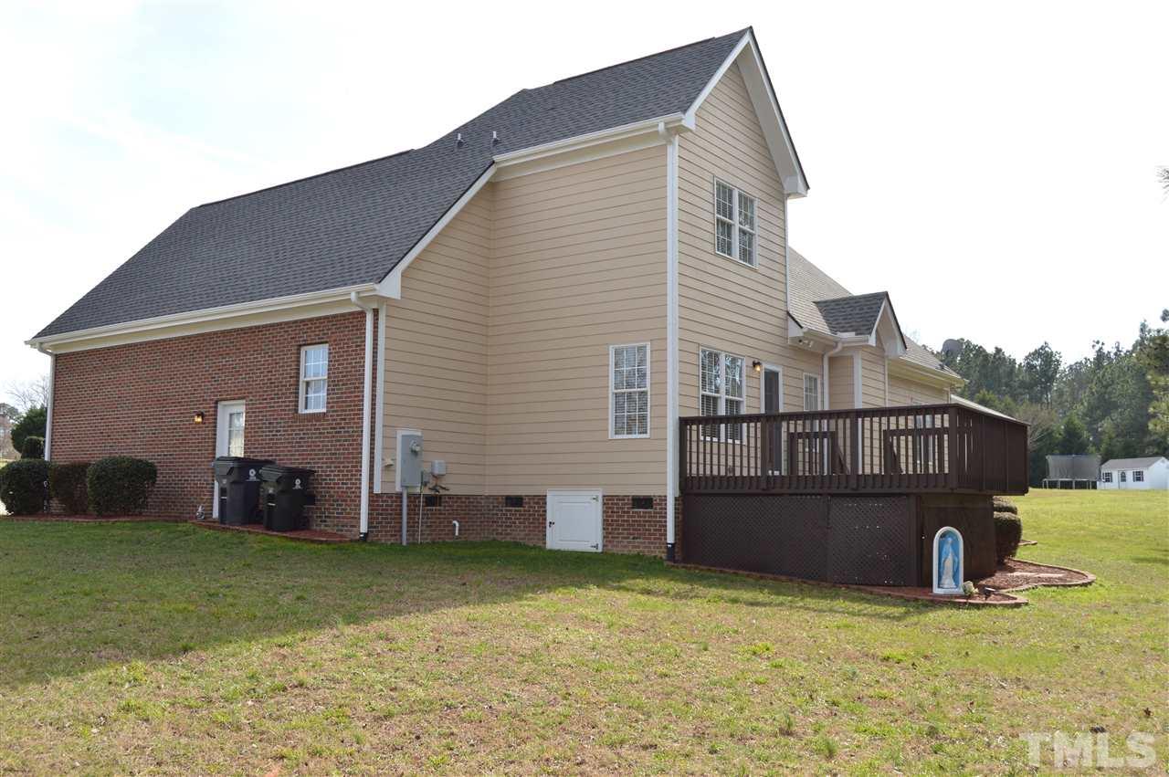 1069 Wheeler Pond Road Creedmoor, NC 27522 - Photo 20 of 22 a view of a house with a back yard