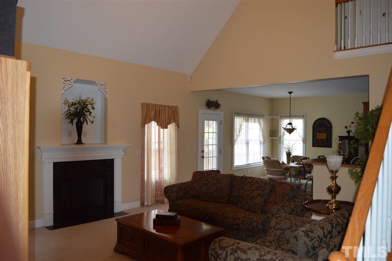 1069 Wheeler Pond Road Creedmoor, NC 27522 - Photo 4 of 22 a living room with furniture and a fireplace