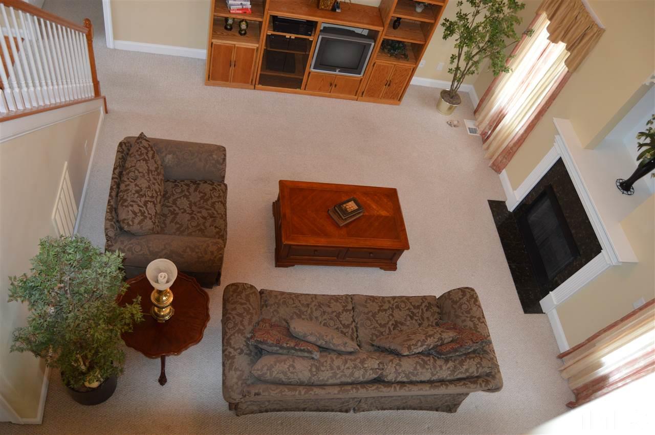 1069 Wheeler Pond Road Creedmoor, NC 27522 - Photo 6 of 22 a living room with furniture and a flat screen tv