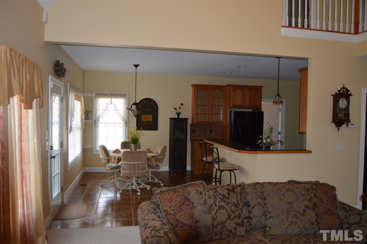 1069 Wheeler Pond Road Creedmoor, NC 27522 - Photo 7 of 22 a living room with furniture and a flat screen tv