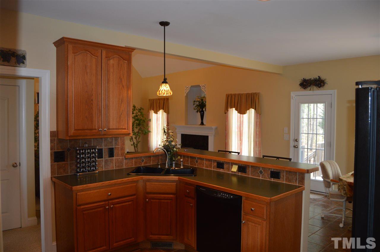 1069 Wheeler Pond Road Creedmoor, NC 27522 - Photo 8 of 22 a kitchen with a sink and a window