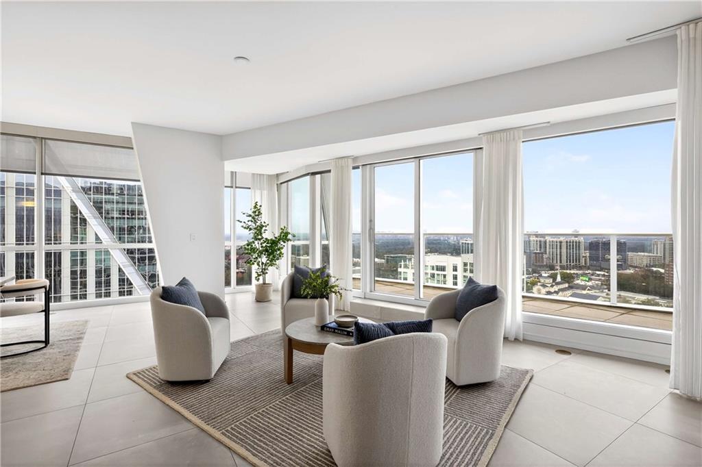 3325 Piedmont Road Northeast, Unit 2804 Atlanta, GA 30305 - Photo 20 of 65 a living room with furniture and floor to ceiling windows