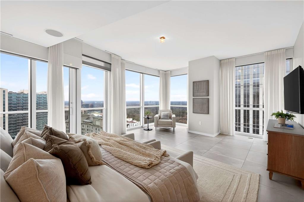 3325 Piedmont Road Northeast, Unit 2804 Atlanta, GA 30305 - Photo 27 of 65 a living room with furniture and large windows