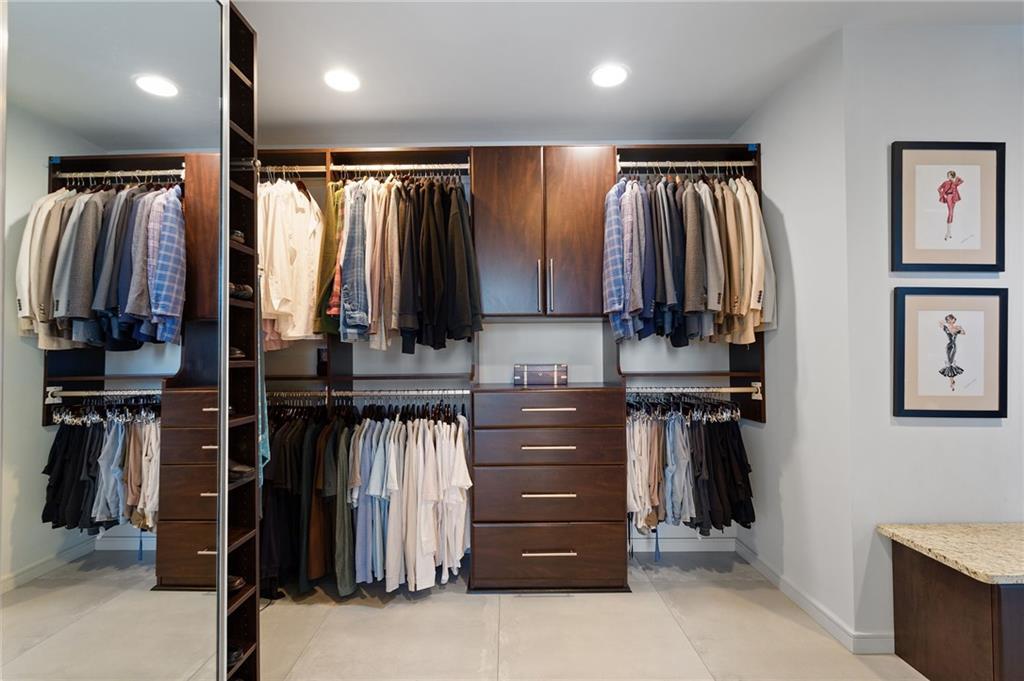 3325 Piedmont Road Northeast, Unit 2804 Atlanta, GA 30305 - Photo 37 of 65 a view of walk in closet with clothes and shoes