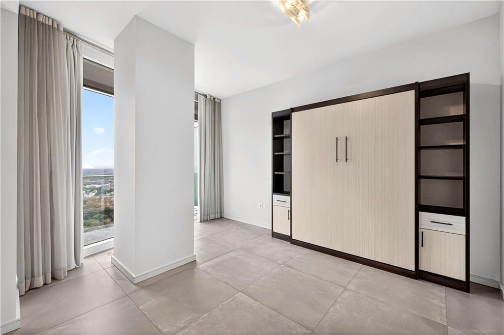 3325 Piedmont Road Northeast, Unit 2804 Atlanta, GA 30305 - Photo 39 of 65 a view of an empty room with a kitchen