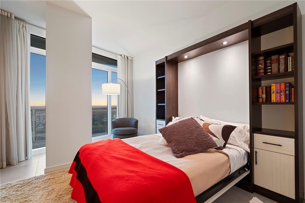 3325 Piedmont Road Northeast, Unit 2804 Atlanta, GA 30305 - Photo 41 of 65 a bedroom with a bed and closet