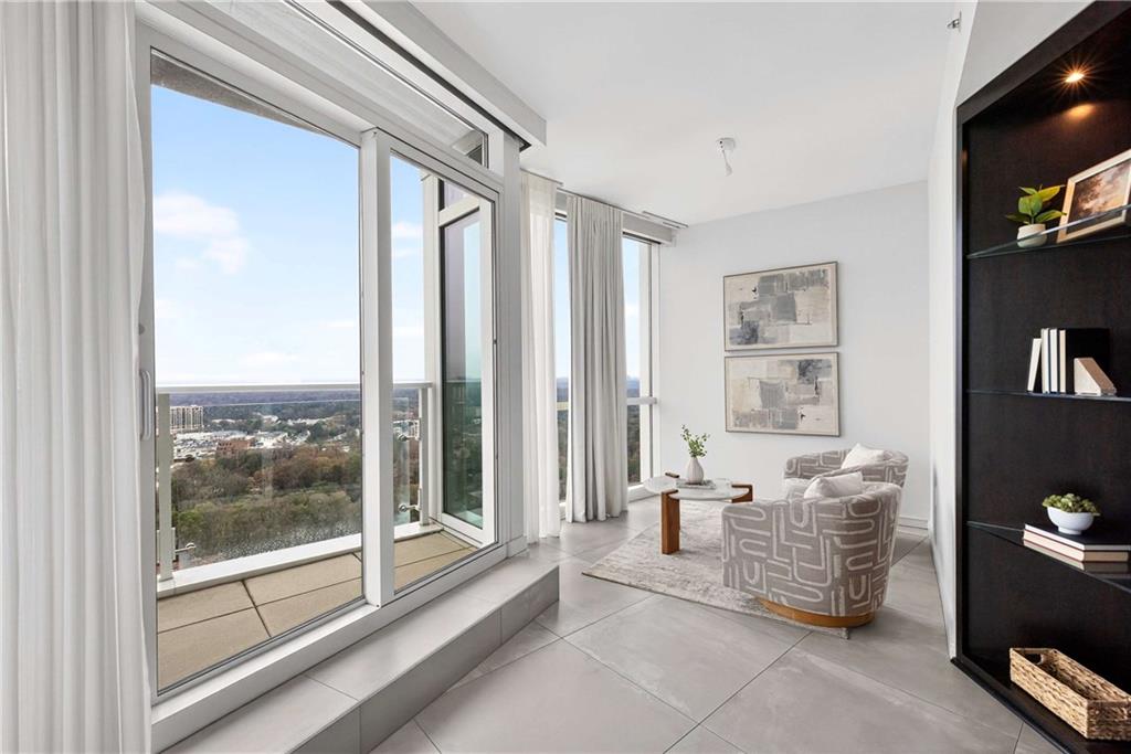3325 Piedmont Road Northeast, Unit 2804 Atlanta, GA 30305 - Photo 8 of 65 a living room with furniture and a floor to ceiling window