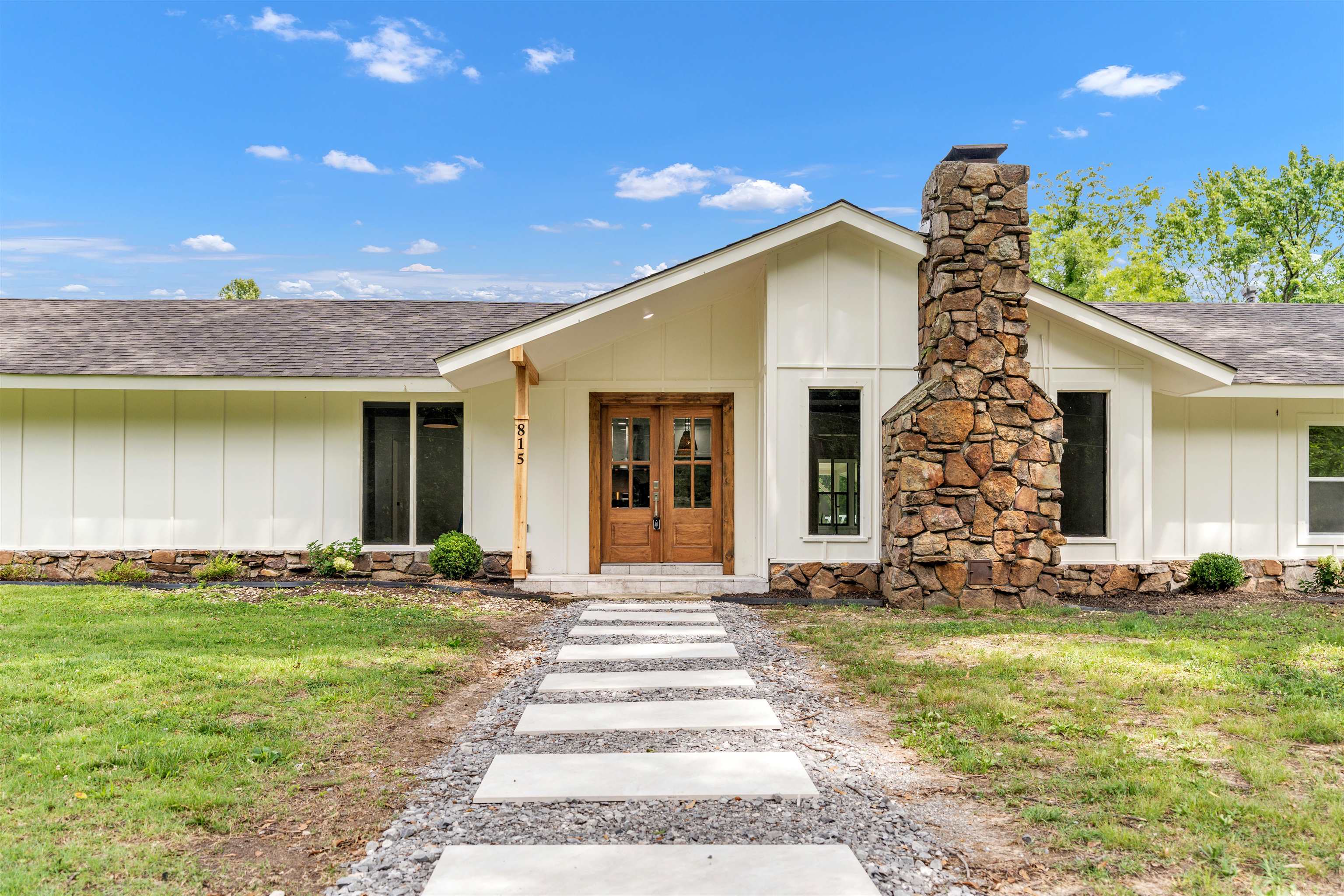 a front view of a house with a yard