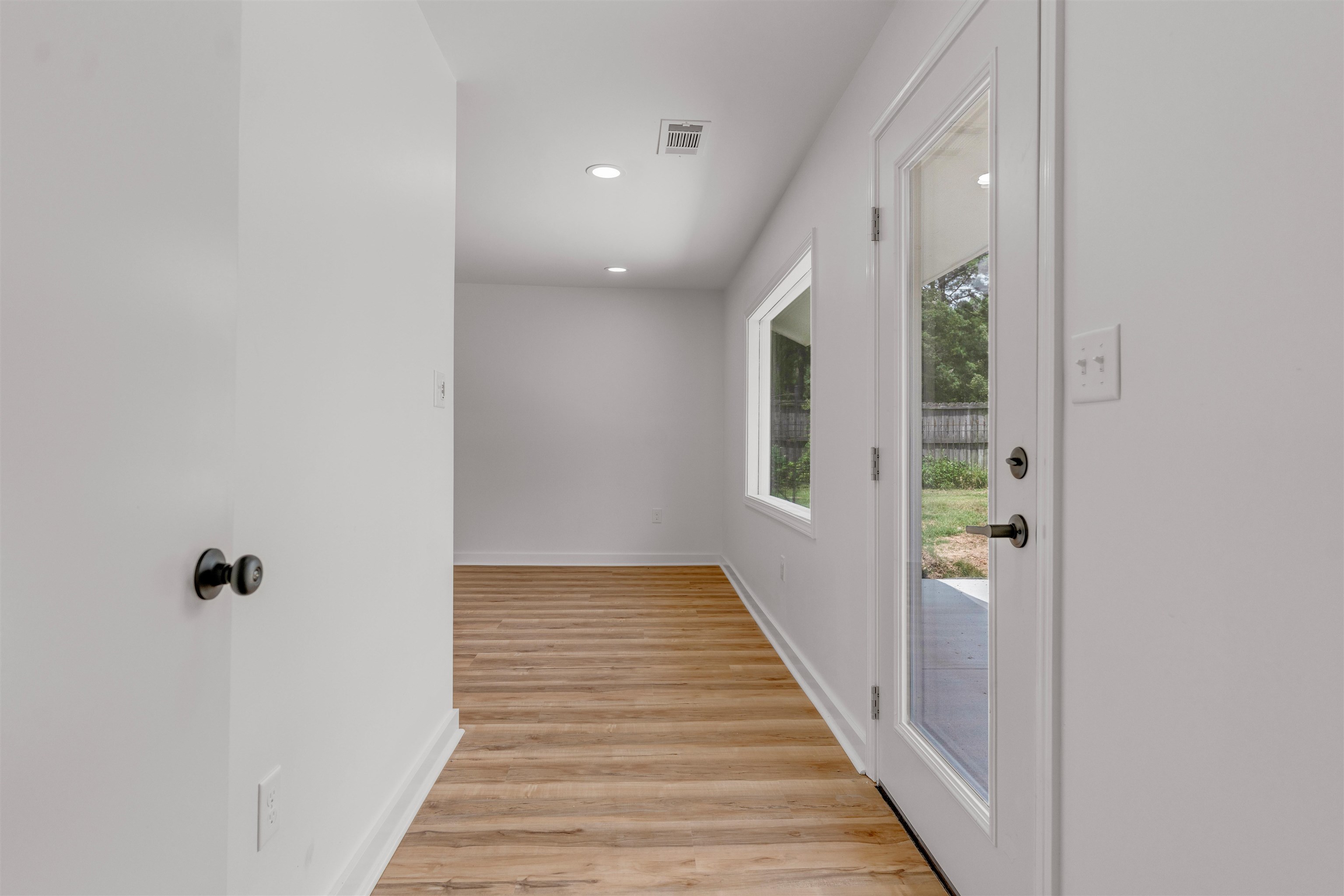 815 Fisherville Road Collierville, TN 38017 - Photo 12 of 40 a view of a hallway with wooden floor and staircase