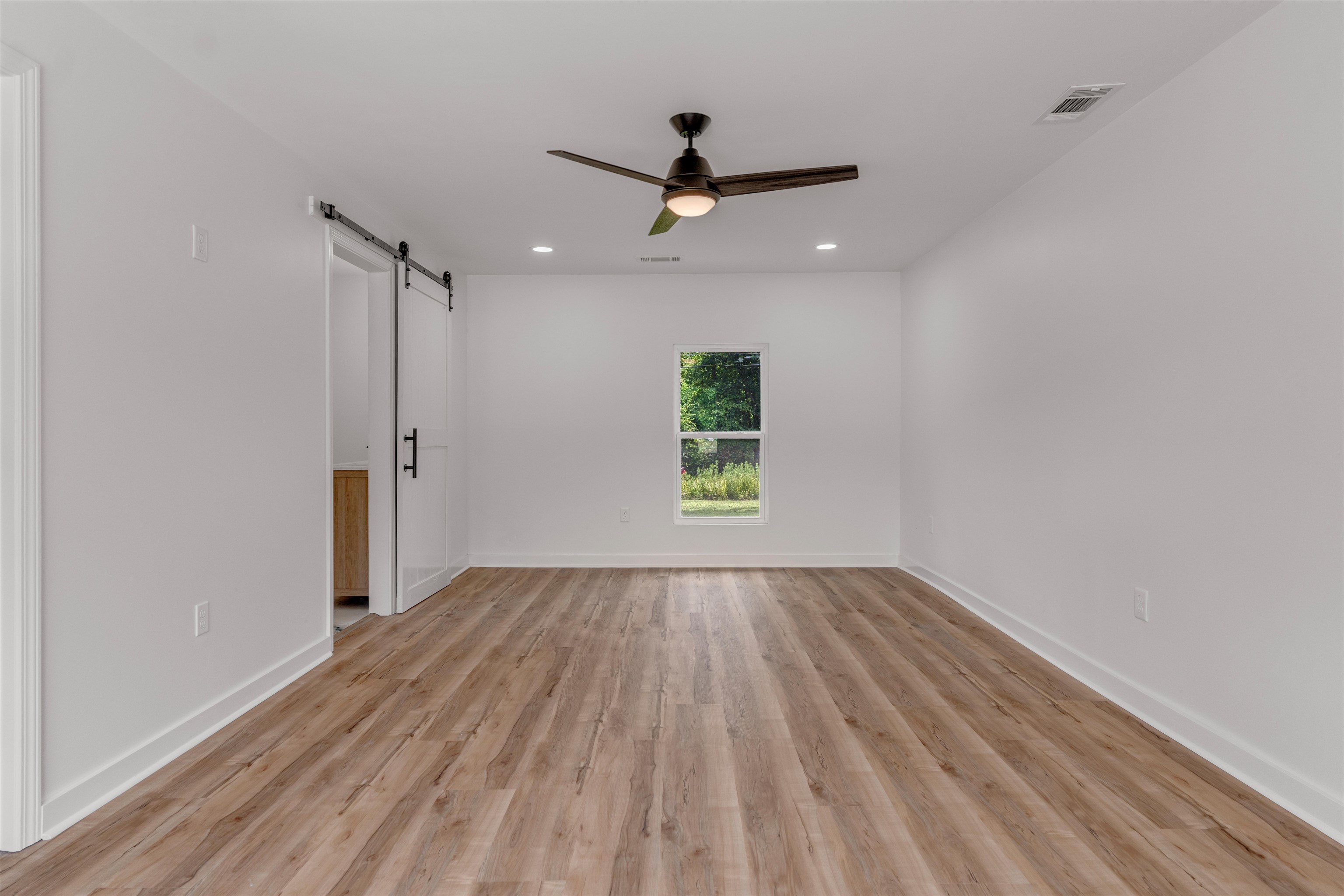 815 Fisherville Road Collierville, TN 38017 - Photo 13 of 40 wooden floor in an empty room with a window