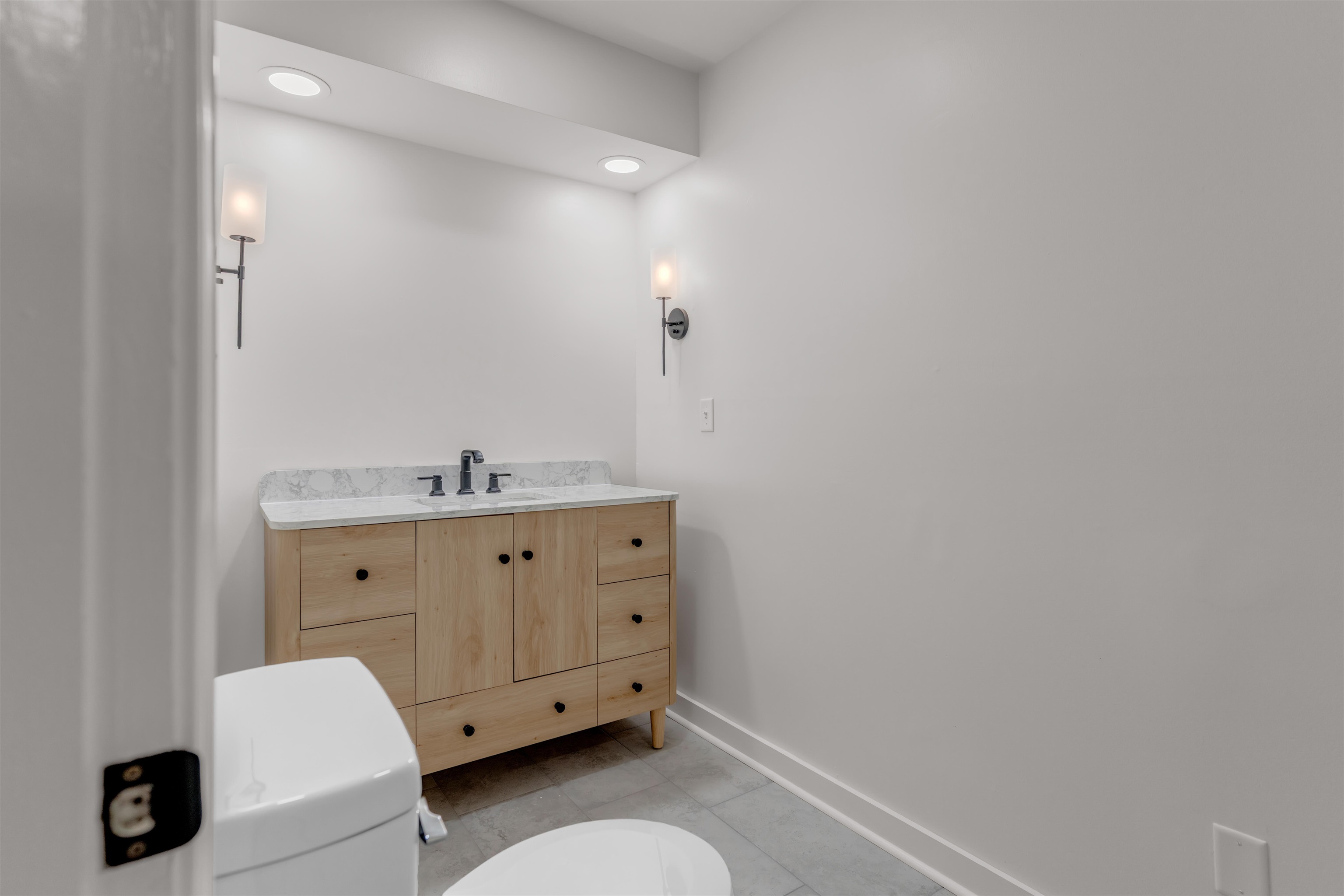 815 Fisherville Road Collierville, TN 38017 - Photo 19 of 40 a bathroom with a granite countertop sink and a mirror