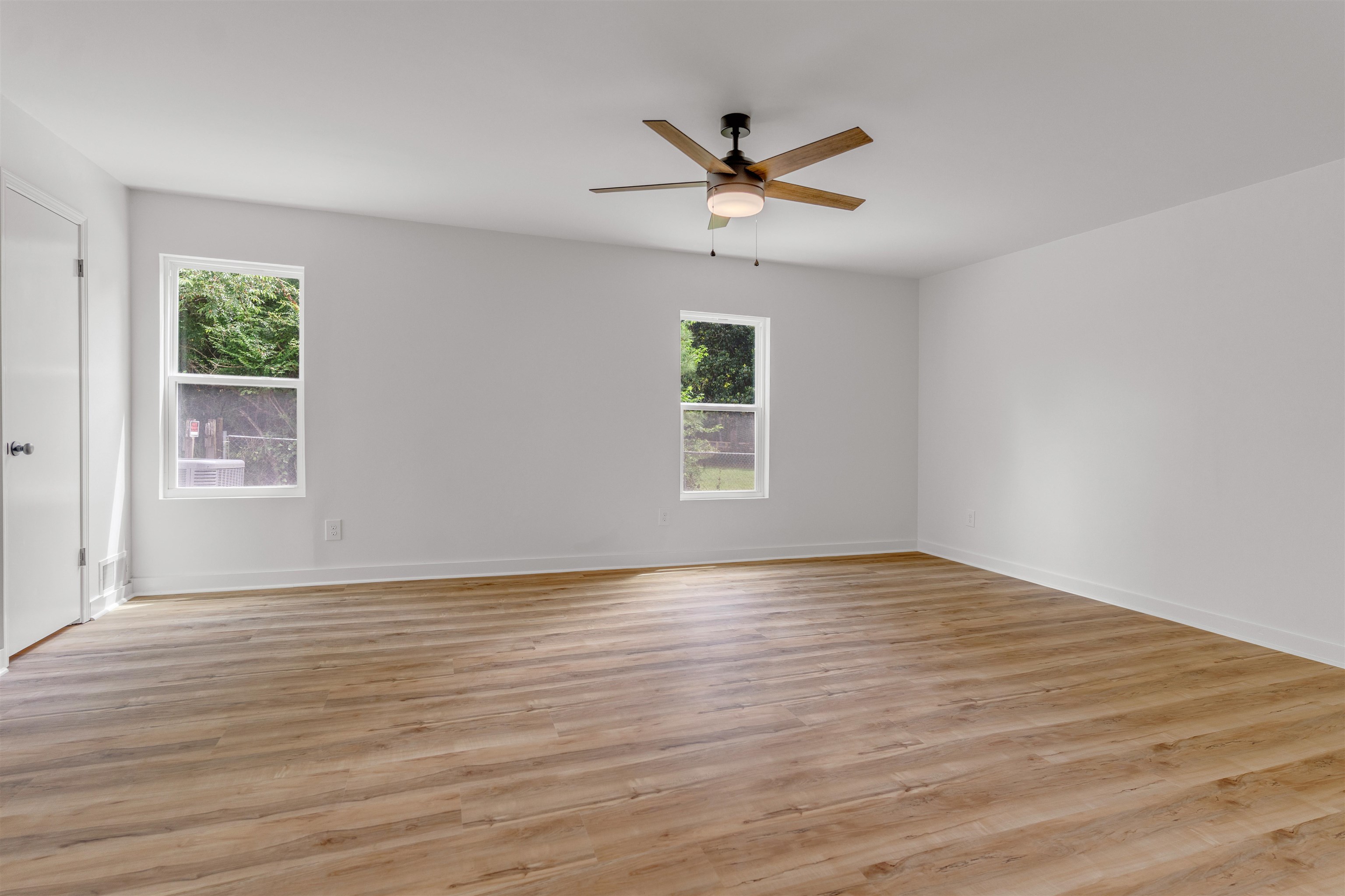 815 Fisherville Road Collierville, TN 38017 - Photo 24 of 40 a view of empty room with wooden floor and fan