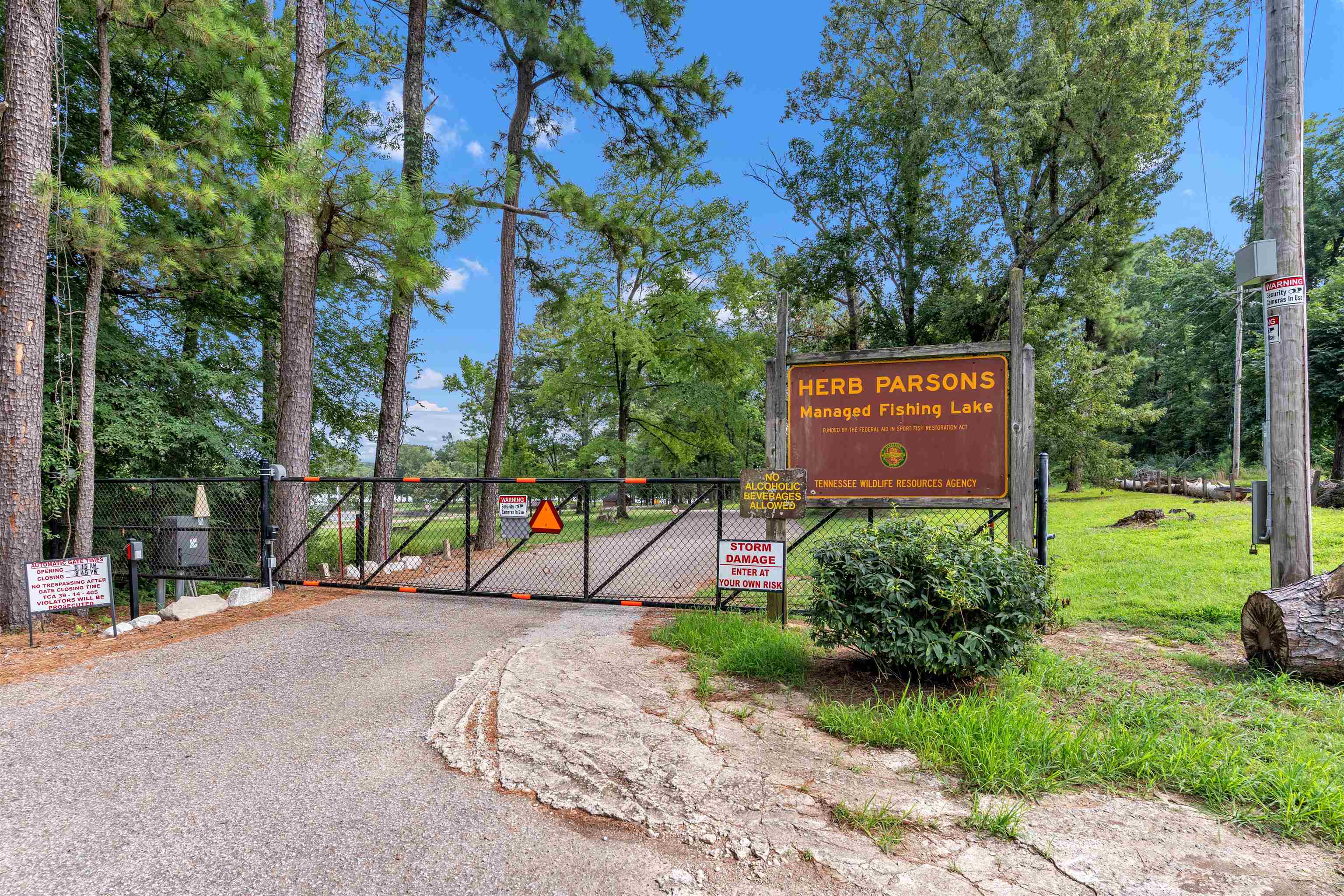 815 Fisherville Road Collierville, TN 38017 - Photo 40 of 40 a sign that is sitting on a wooden bench in a yard