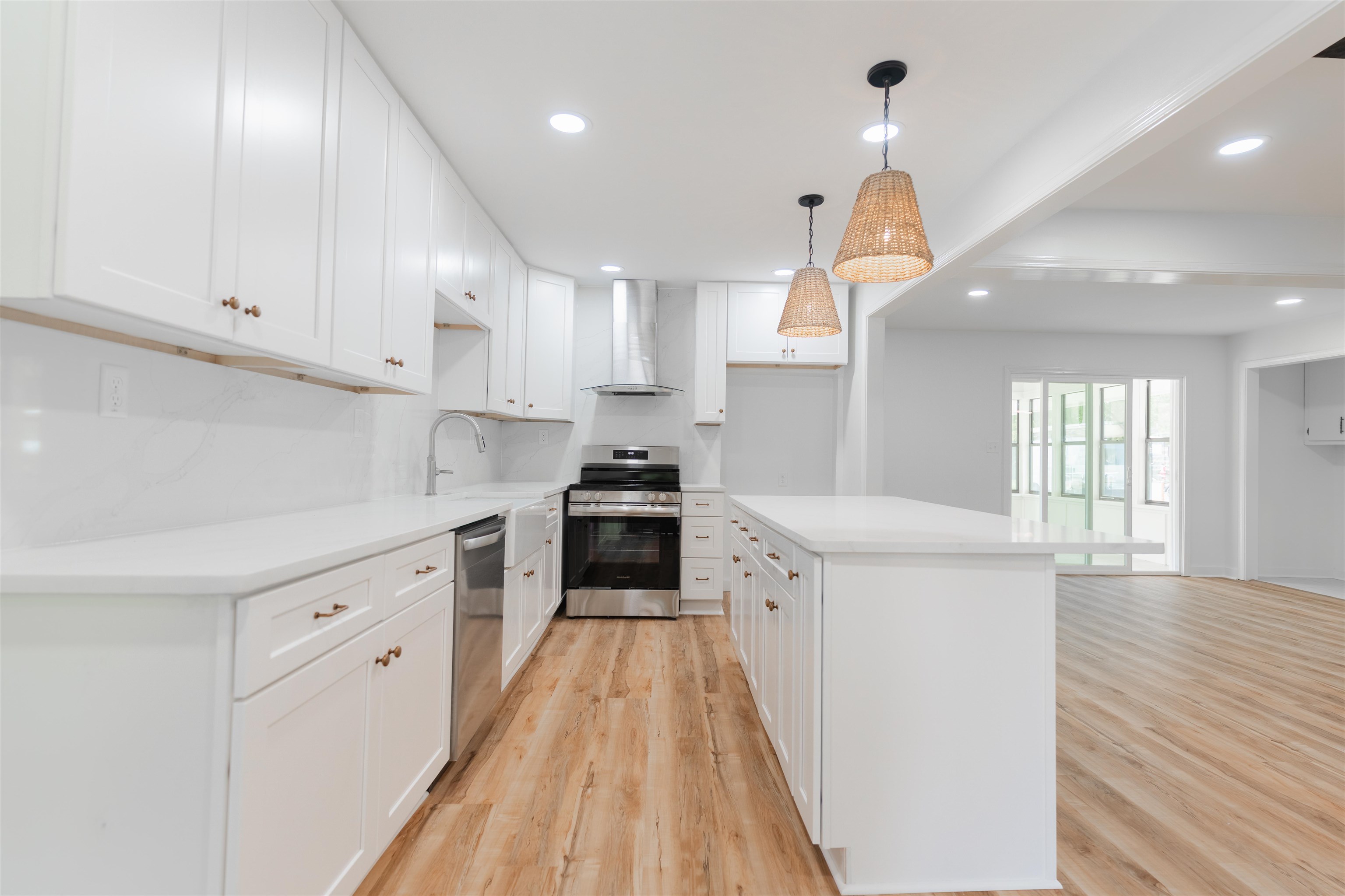 815 Fisherville Road Collierville, TN 38017 - Photo 5 of 40 a kitchen with cabinets wooden floor and a sink