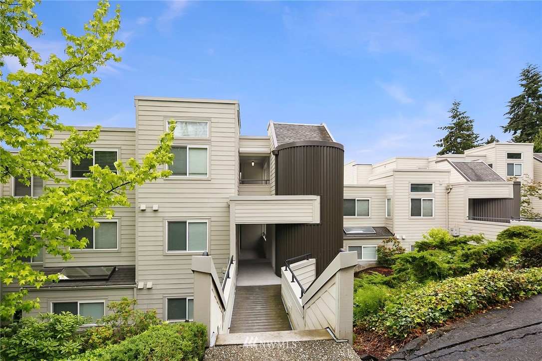 7407 Old Redmond Road, Unit 207 Redmond, WA 98052 - Photo 1 of 23 a front view of a house with a garden