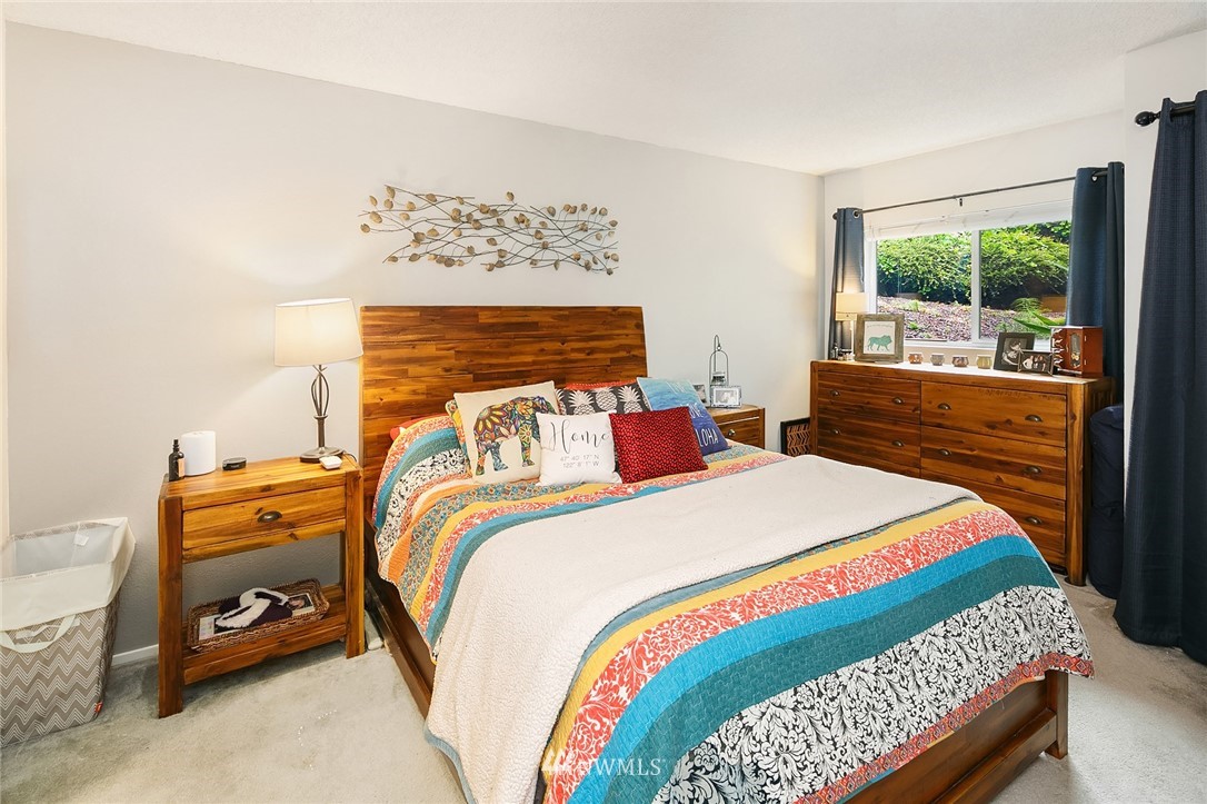 7407 Old Redmond Road, Unit 207 Redmond, WA 98052 - Photo 19 of 23 a bed sitting in a bedroom next to a window
