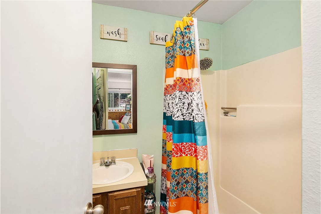 7407 Old Redmond Road, Unit 207 Redmond, WA 98052 - Photo 20 of 23 a bathroom with a sink and a mirror