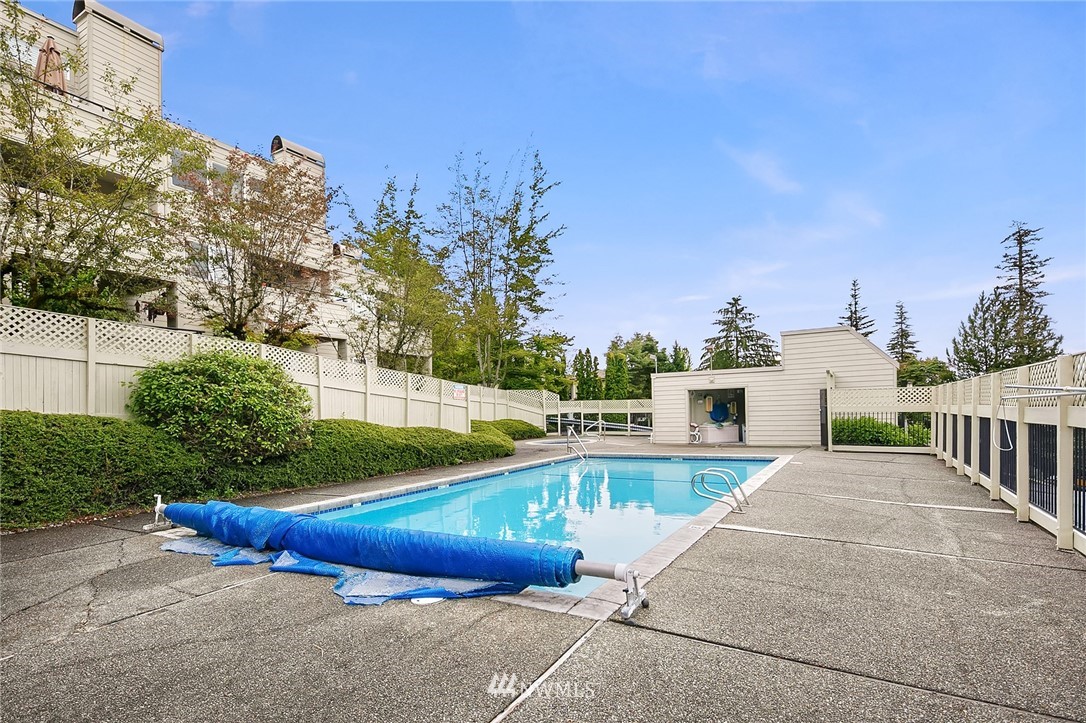 7407 Old Redmond Road, Unit 207 Redmond, WA 98052 - Photo 21 of 23 a view of a swimming pool with a lounge chairs