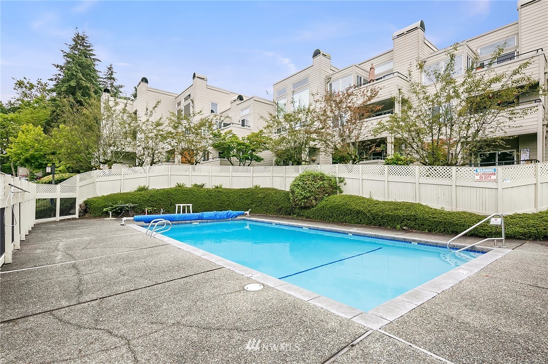 7407 Old Redmond Road, Unit 207 Redmond, WA 98052 - Photo 22 of 23 a view of a house with pool and a yard