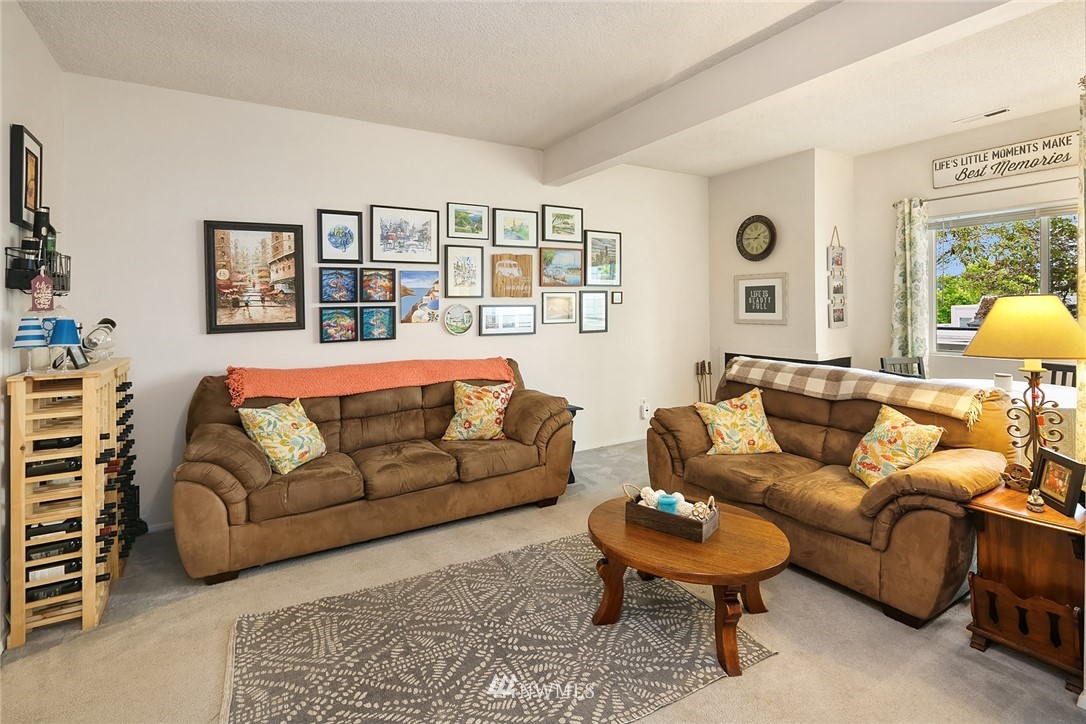 7407 Old Redmond Road, Unit 207 Redmond, WA 98052 - Photo 7 of 23 a living room with furniture a rug and a window