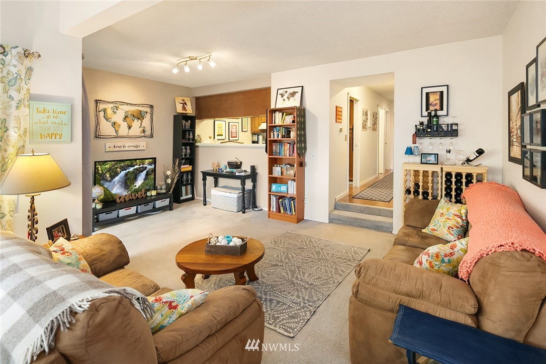 7407 Old Redmond Road, Unit 207 Redmond, WA 98052 - Photo 9 of 23 a living room with furniture and a wooden floor