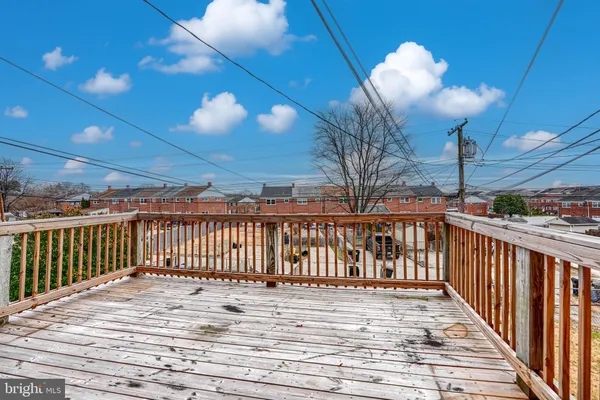 a view of a balcony with wooden floor