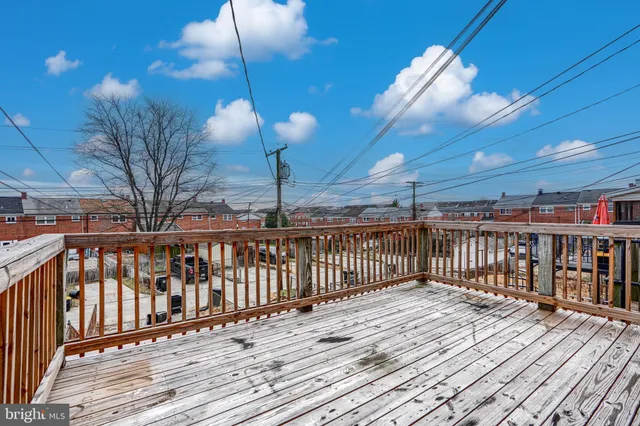 a view of a balcony with wooden floor