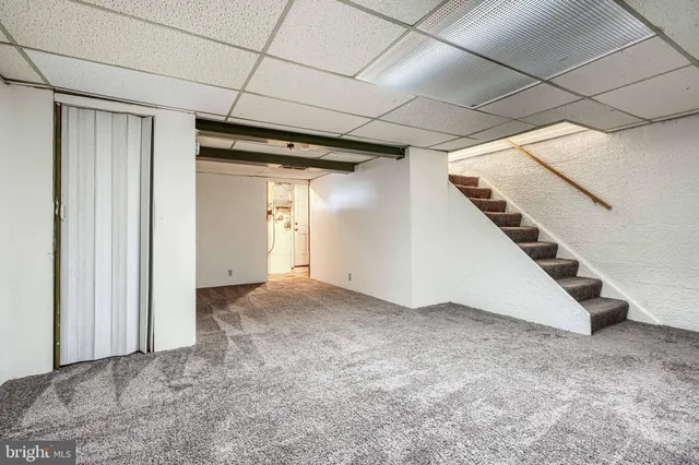 a view of an empty room with stairs