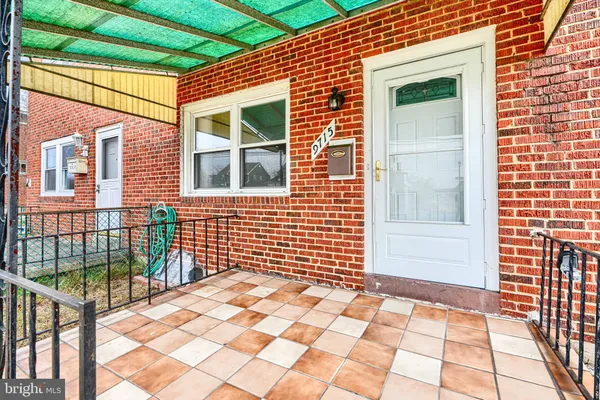 a view of a brick house with many windows