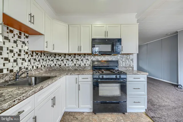 a kitchen with a stove and a sink
