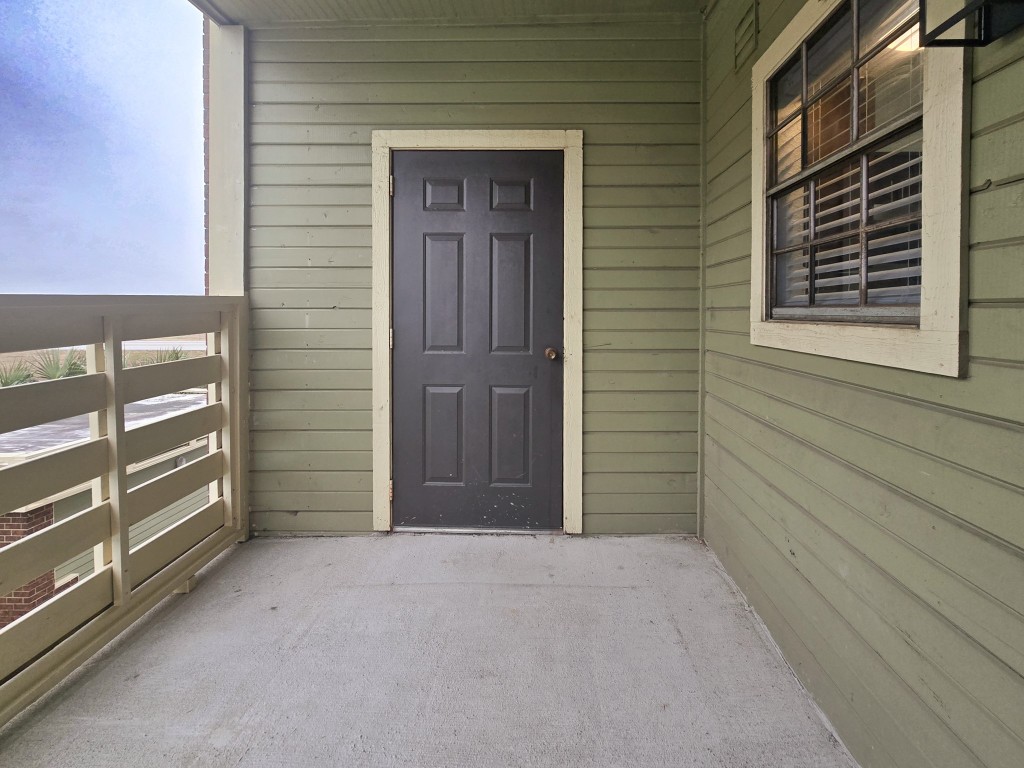 500 Ferry Road, Unit 323C Galveston, TX 77550 - Photo 15 of 17 a view of outdoor space and front door