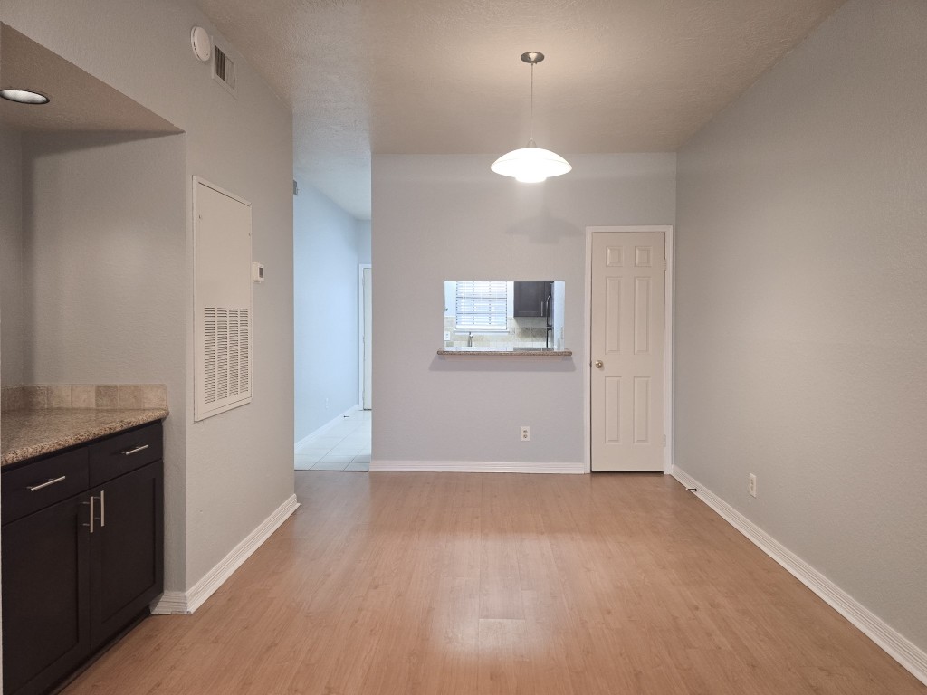 500 Ferry Road, Unit 323C Galveston, TX 77550 - Photo 3 of 17 a view of an empty room with a kitchen