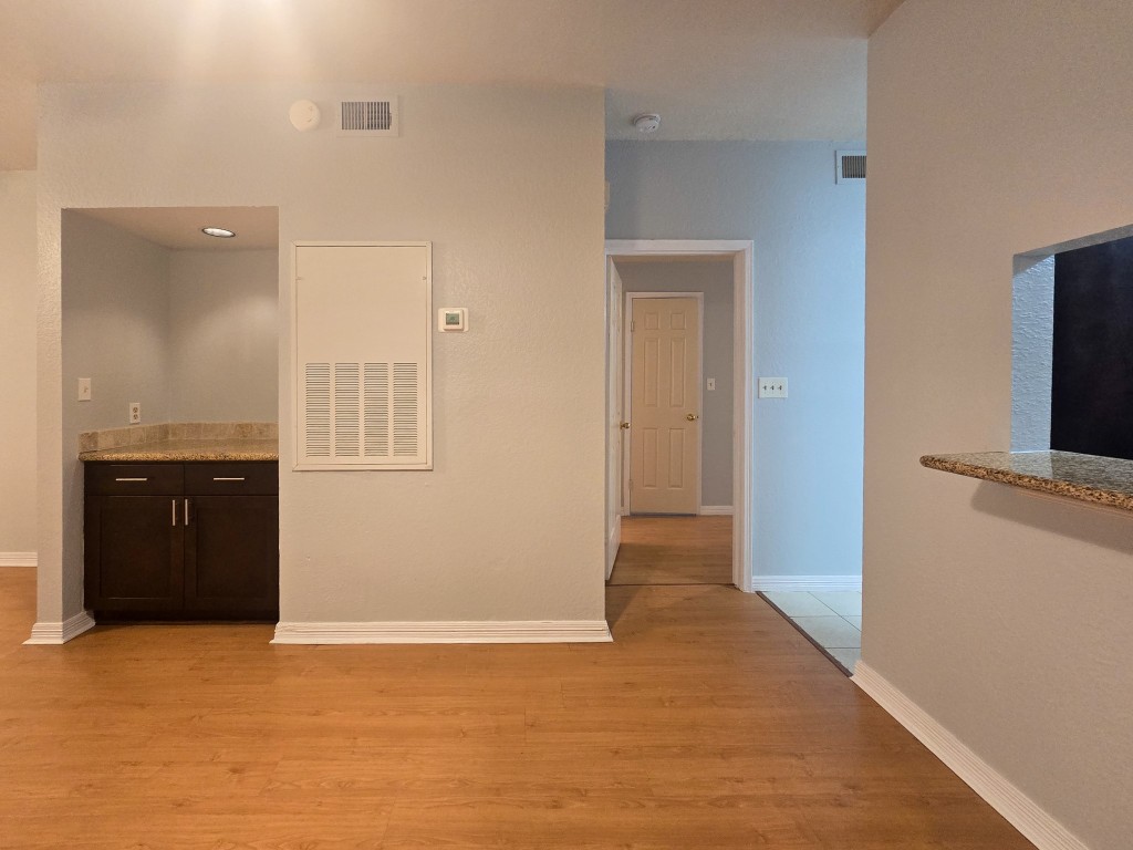 500 Ferry Road, Unit 323C Galveston, TX 77550 - Photo 4 of 17 a view of an empty room with a kitchen