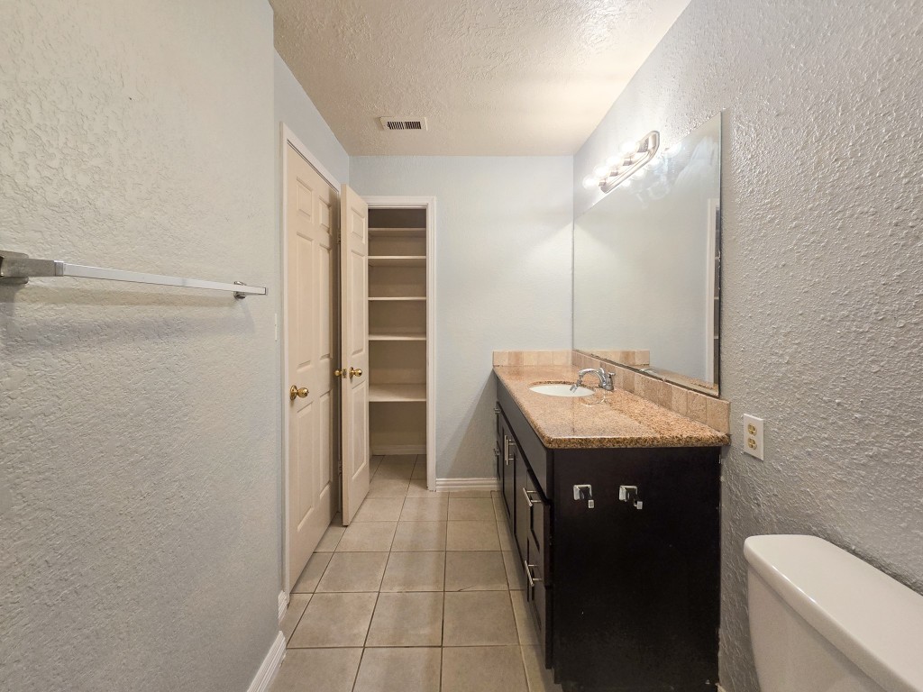 500 Ferry Road, Unit 323C Galveston, TX 77550 - Photo 7 of 17 a bathroom with a sink a toilet and shower