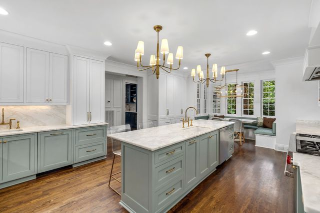 a bedroom with furniture and a chandelier