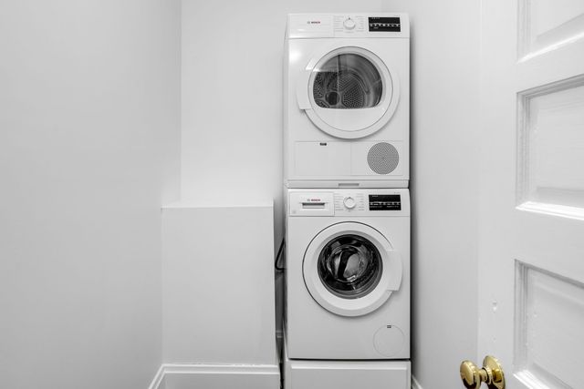 a view of a grassy field with trees