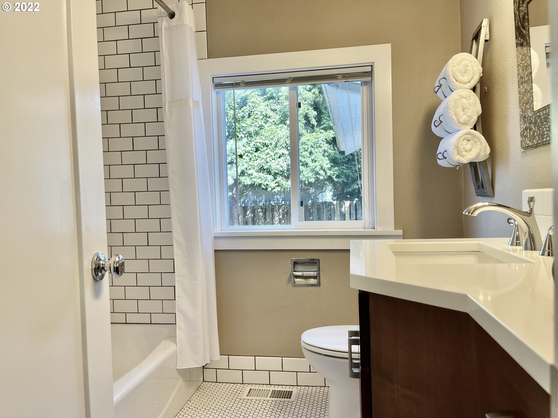 7136 North Chase Avenue Portland, OR 97217 - Photo 22 of 26 a bathroom with a sink a toilet and shower